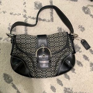 Black Coach purse with buckle.
